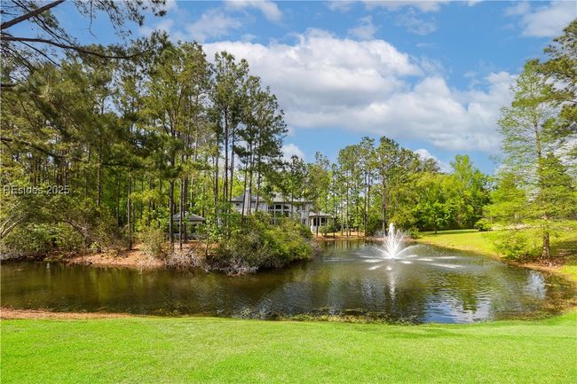 View of the fountain from the rear of the home. Another fountain is visible to the left as well. It is very relaxing to listen to the fountain. | Image 57