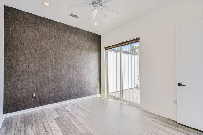 The primary suite is located on the upper level with direct access to the balcony and a gorgeous ensuite bath. | Image 27