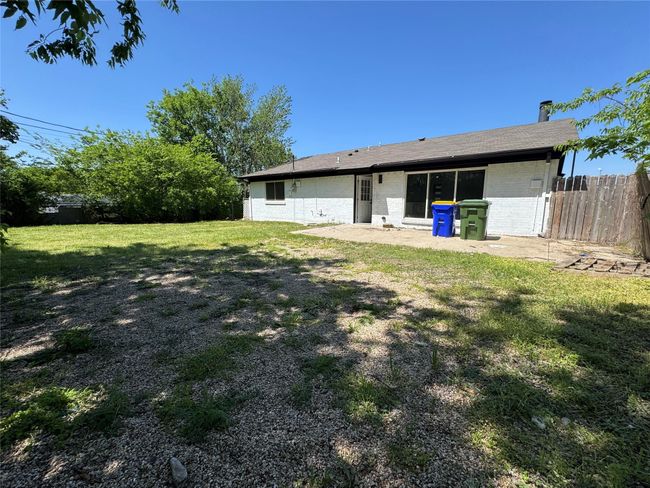Back of property with a yard, a patio area, fence, and brick siding | Image 23