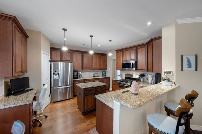 Kitchen with stainless steel appliances | Image 13