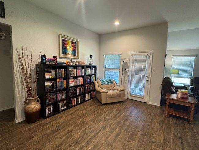 Sitting room with wood finished floors | Image 12