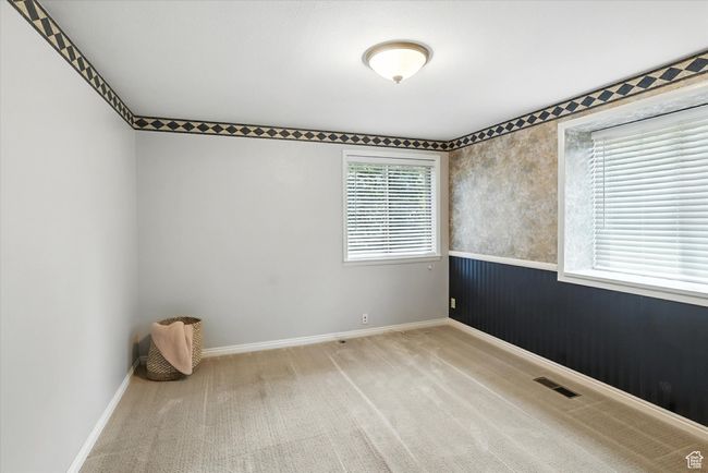Bedroom with carpet and a wainscoted wall | Image 17