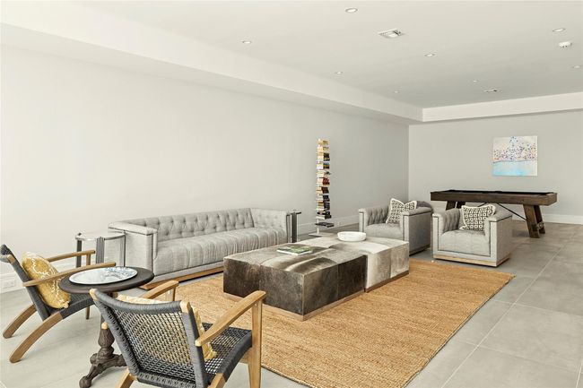 Living room featuring recessed lighting, a tray ceiling, and light tile patterned floors | Image 25