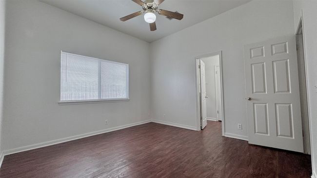Primary bedroom ceiling fan, walk in closet and primary bathroom | Image 9