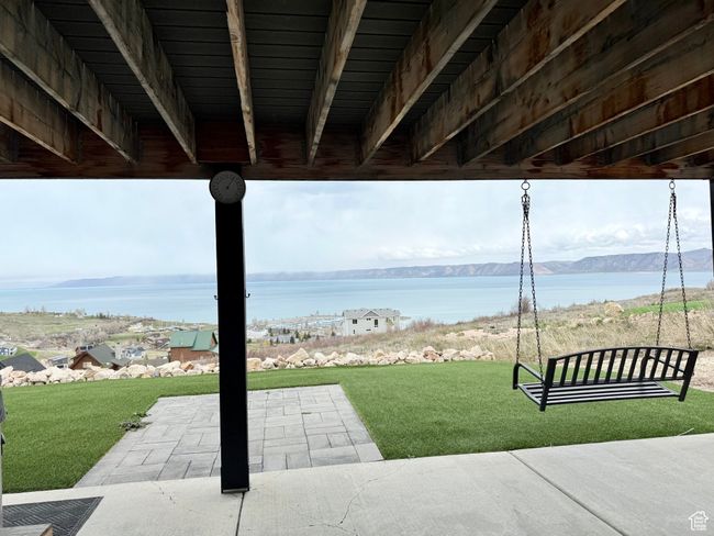 View of patio / terrace with a water and mountain view | Image 43