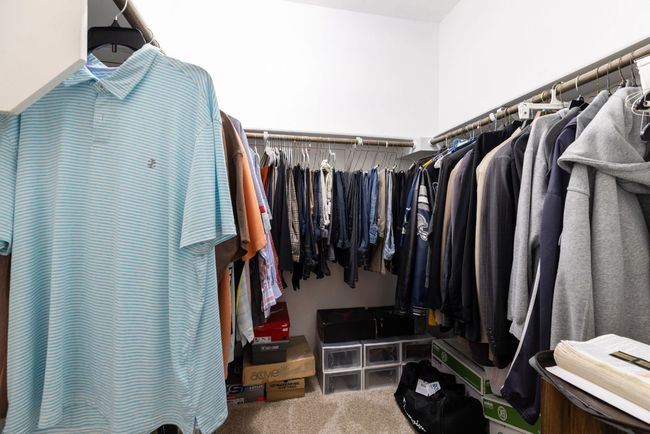 Walk in closet featuring carpet | Image 32