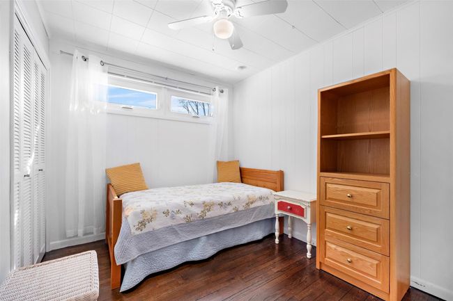 Bedroom featuring a ceiling fan, a closet, and dark wood finished floors | Image 27