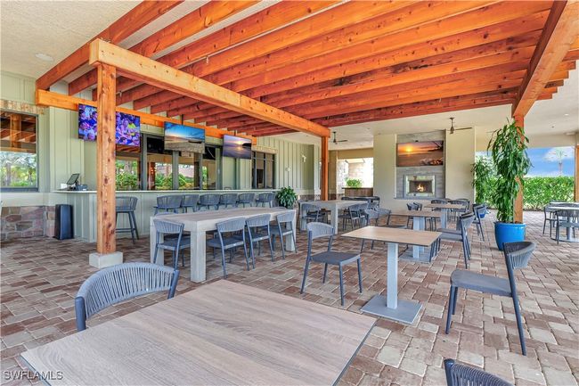 View of patio/lanai featuring an outdoor bar | Image 39