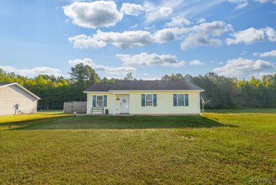 View of front facade with a front yard | Image 1