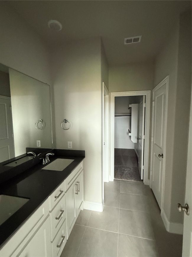 Full bathroom with double vanity and tile patterned floors | Image 14