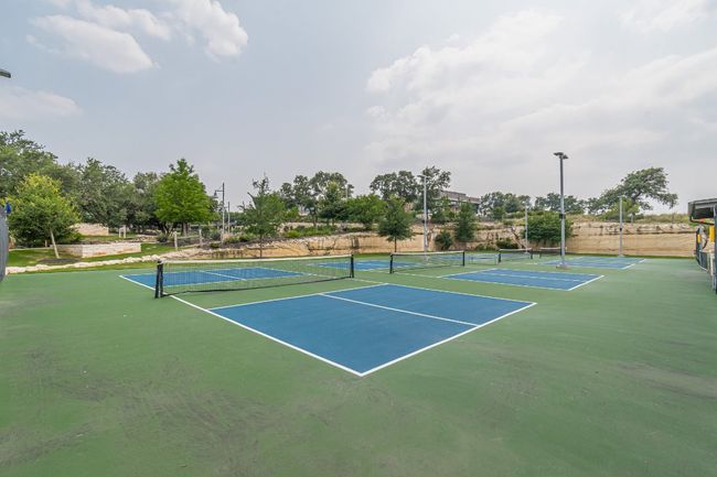 View of tennis court featuring community basketball court | Image 27