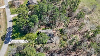 Aerial view of property. Lot is wide and house is sitting on right side when facing it. | Image 3