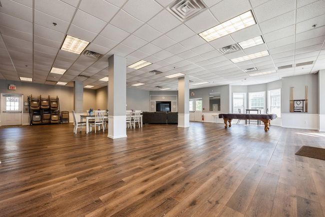 Misc room featuring wood finished floors, visible vents, and pool table | Image 18