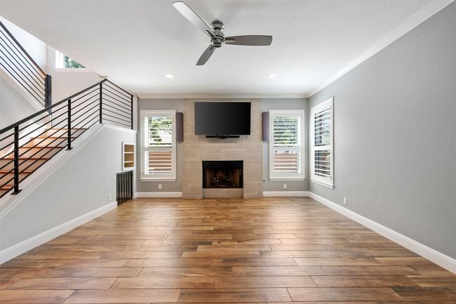 Mounted television is included and it can be lowered movie night. | Image 17