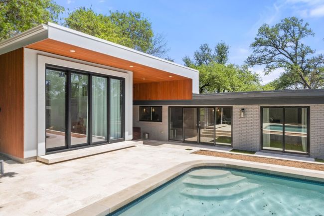 Back of property with a patio, brick siding, and an outdoor pool | Image 30