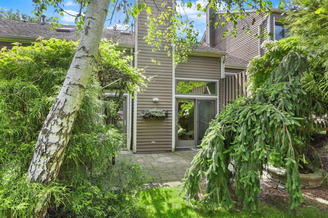 Back of house with a patio area and roof with shingles | Image 32