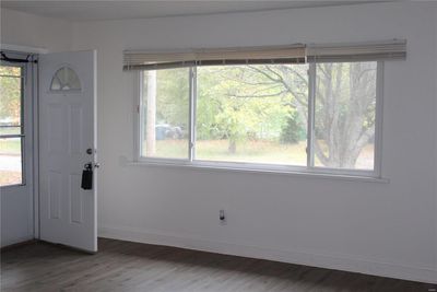 Entryway with a wealth of natural light and laminate flooring | Image 3