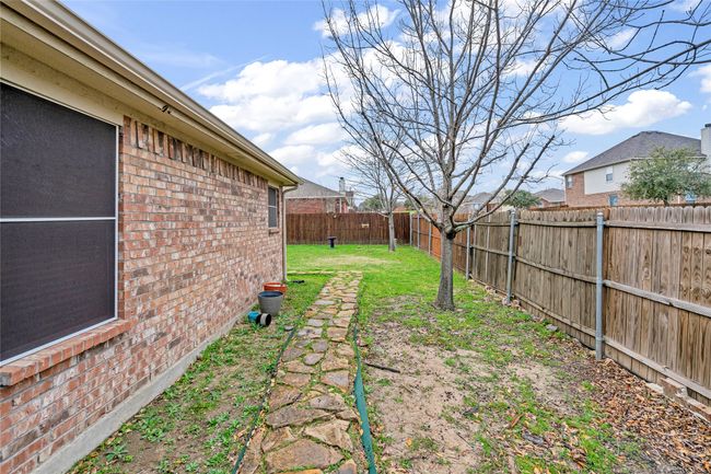 View of fenced backyard | Image 29