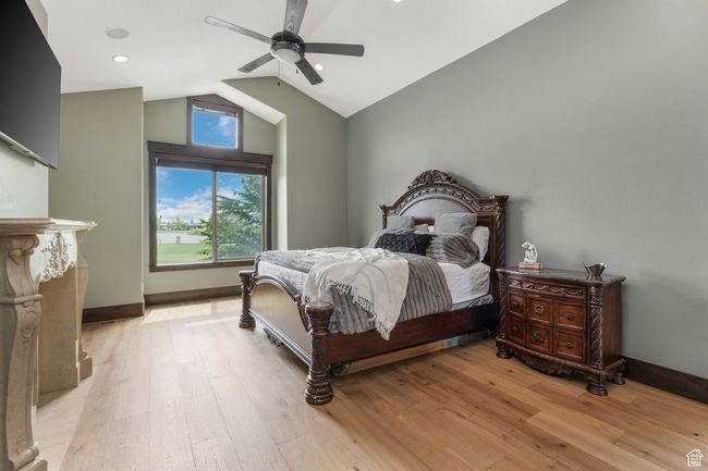 Primary Suite with vaulted ceiling, baseboards, a ceiling fan, and light wood-style flooring | Image 6