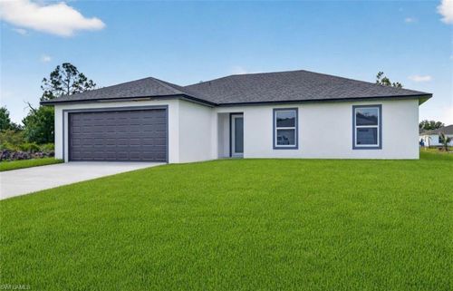 704 Carbon St E, LEHIGH ACRES, FL, 33974-9504 | Card Image