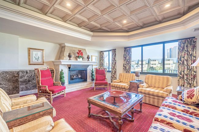 Playroom featuring pool table, a tray ceiling, carpet flooring, and built in shelves | Image 24