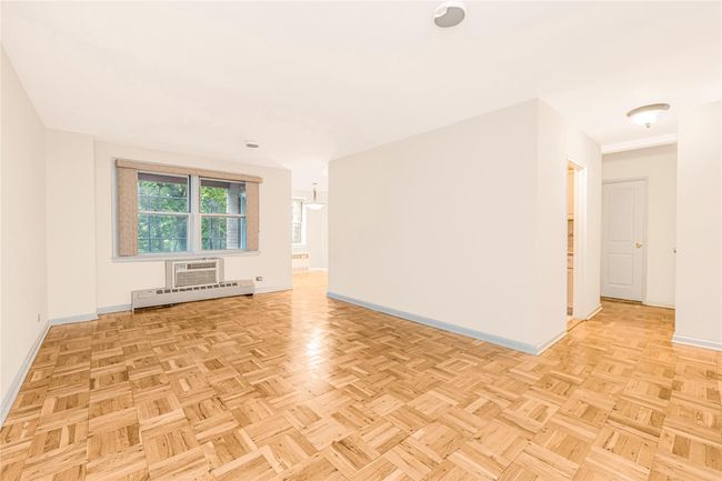 Spare room featuring baseboards | Image 13