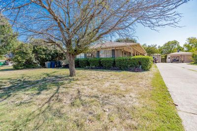 View of front of home featuring a front yard | Image 1