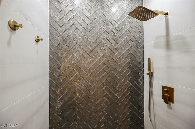 Downstair 3/4 Bathroom with Details featuring tiled shower | Image 29