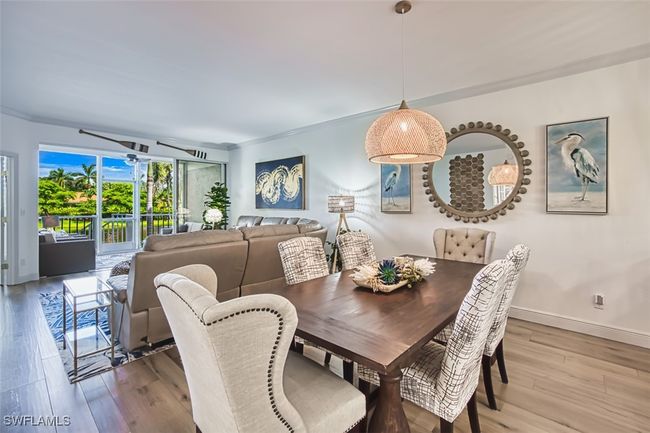 Dining space with baseboards and wood finished floors | Image 18