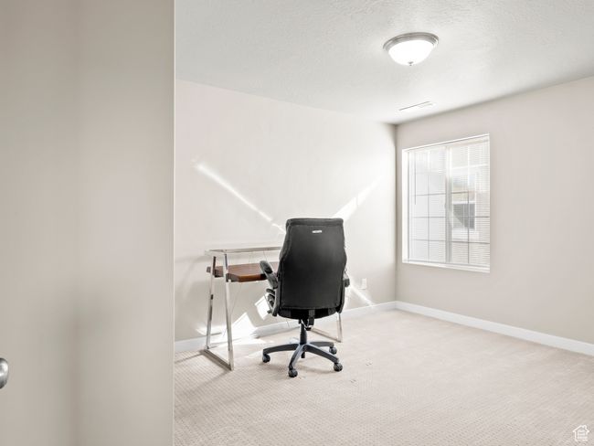 Home office with carpet floors and a textured ceiling | Image 20