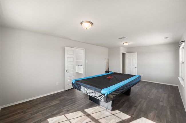 Playroom with visible vents, baseboards, pool table, and wood finished floors | Image 31