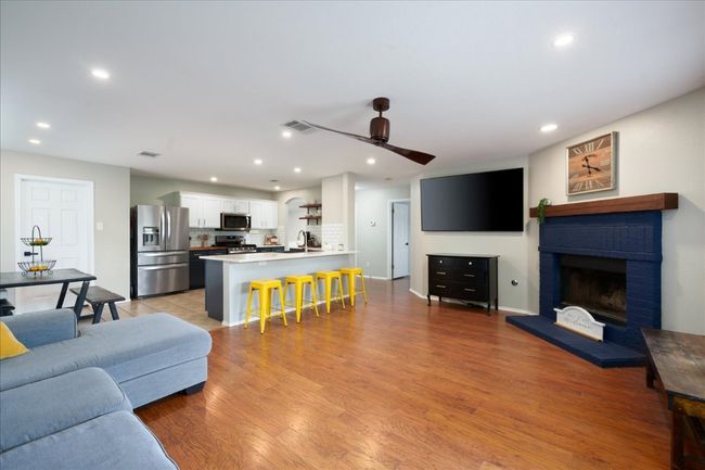 This den has a beautiful fireplace for cool winter nights! | Image 23