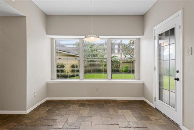 A large breakfast area with huge windows is a great place to start the day with loved ones or enjoy the time of peace before the day begins! | Image 11