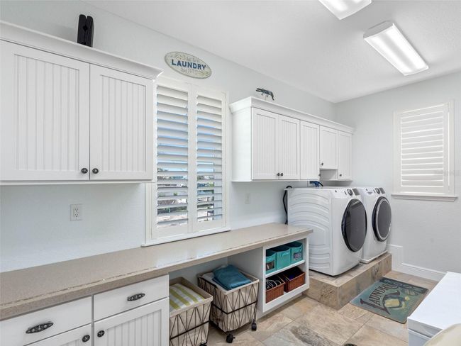 Interior laundry room with cabinets | Image 46