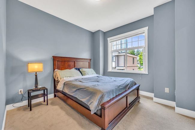 Carpeted bedroom with baseboards | Image 18