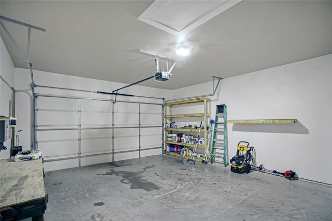 Garage featuring a garage door opener | Image 40