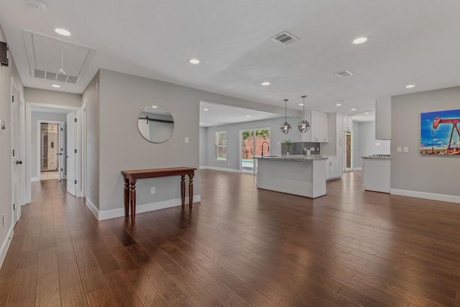 View from the front entry showcasing the open concept living of the home. There is ample space to make it what works best for your family. | Image 4
