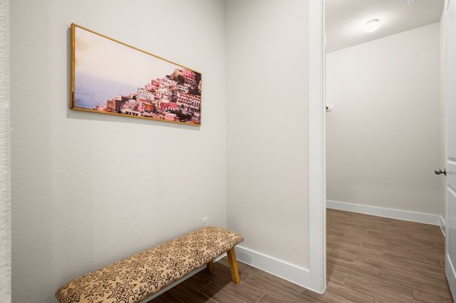 Mudroom with wood finished floors and baseboards | Image 4