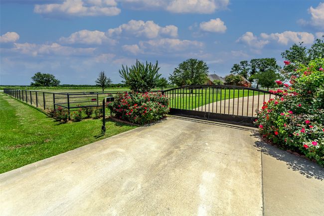GATED ENTRANCE...Concrete Driveway | Image 5