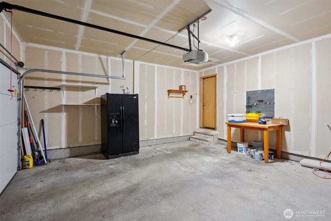 2 car garage, fridge stays! Fast EV charger installed and will stay as well | Image 27