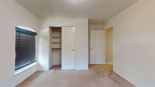 Bright upstairs guest bedroom with ample closet space. | Image 40
