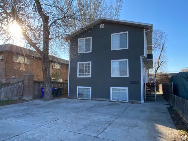 Rear view of house featuring stucco siding and a patio | Image 30