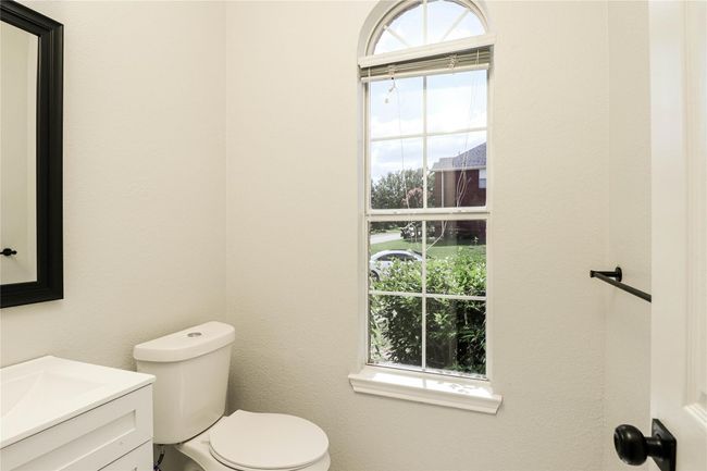 Bathroom featuring vanity and toilet | Image 10