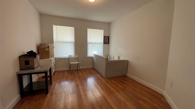 Home office with wood finished floors and baseboards | Image 13
