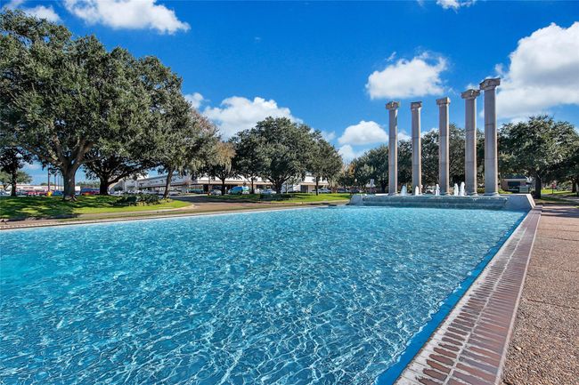 Dive into luxury at the Sugar Creek Country Club pool! This well-maintained swimming area offers plenty of space for relaxation and recreation, with shaded seating, a spacious deck, and stunning golf course views. Whether you're enjoying a refreshing swim or soaking up the sun, this poolside retreat is the perfect spot to unwind. | Image 45