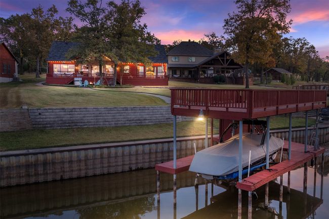 Dock area with a deck with water view and a yard | Image 33