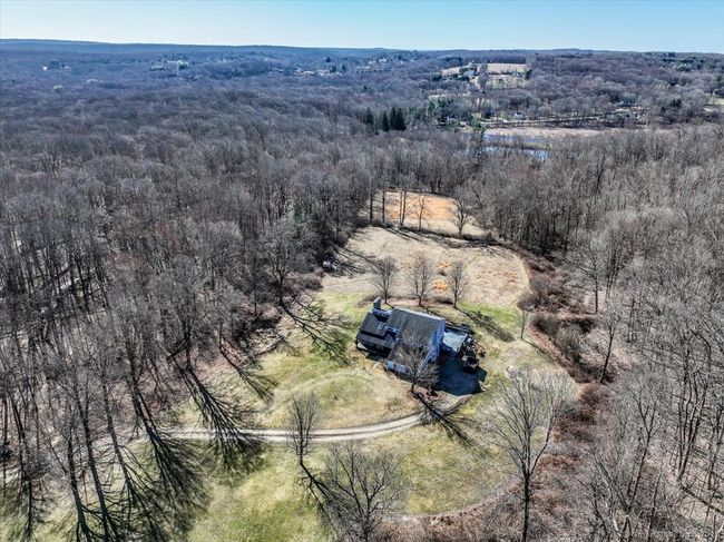Welcome home to your own private sanctuary in the woods. | Image 40