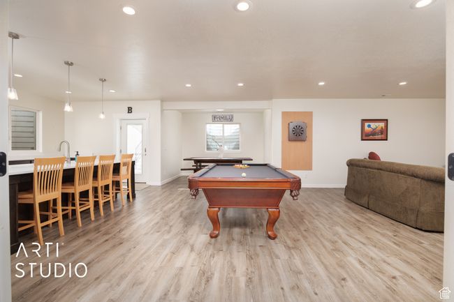 Rec room with sink, light hardwood / wood-style floors, and billiards | Image 28