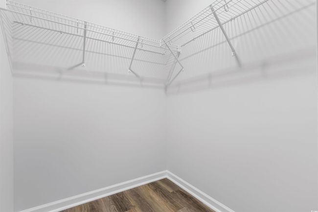 Walk in closet with hardwood / wood-style floors | Image 11