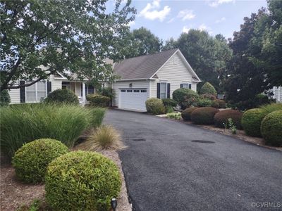 View of front of property with a garage | Image 1